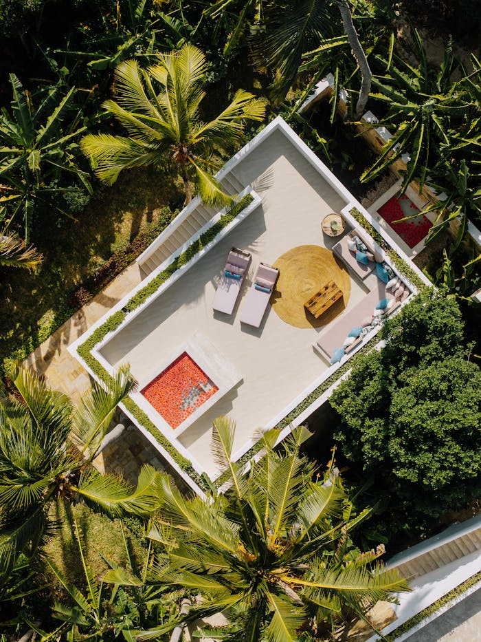 Aerial view of a luxurious resort terrace surrounded by greenery in Zanzibar, Tanzania.